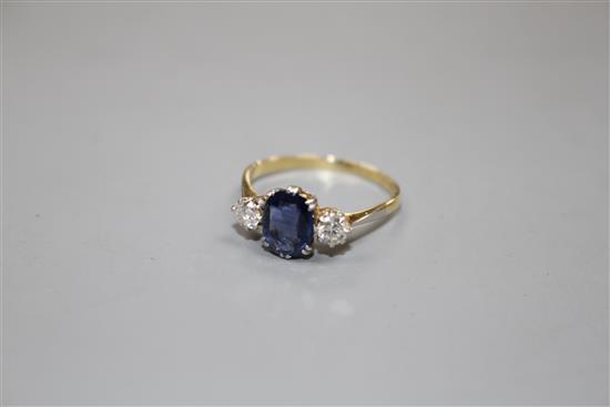 An 18ct and Plat, sapphire and diamond set three stone ring, size O/P, gross weight 2.3 grams.